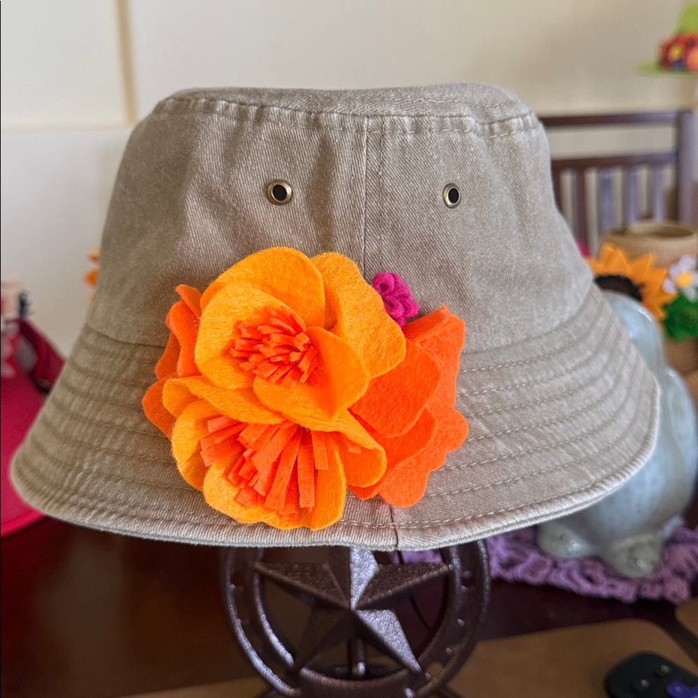 Poppy’s Anyone?Hand Crafted Petal by Petal Poppy’s.  Arranged on a bucket hat